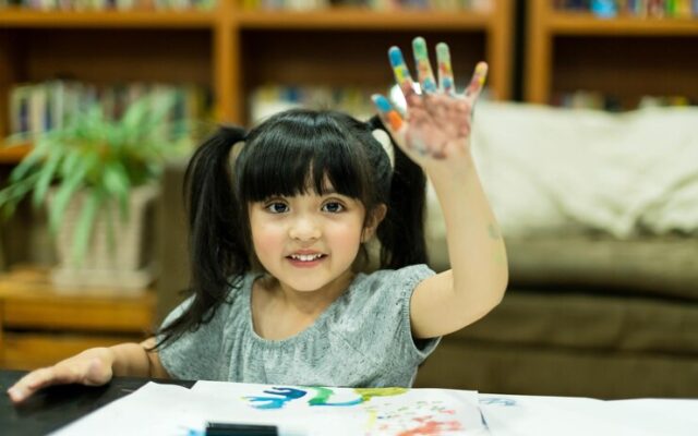 cheerful-girl-kid-enjoy-color-painting-with-creativity-ideas-present-messy-hand-home_609648-2261